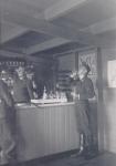 96. German Luftwaffe soldiers drinking schnaps in Hotel Ponsen in Dordrecht during the Second World War. thumbnail