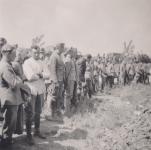 32. Dutch prisoners of war at the graves of fallen soldiers near the Tweede Tol. thumbnail