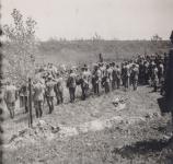 33. Dutch prisoners of war render an honor salute at the graves of their fallen comrades near the Tweede Tol in May 1940. thumbnail